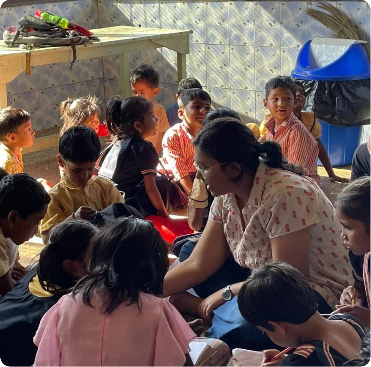 A care worker spending time with children