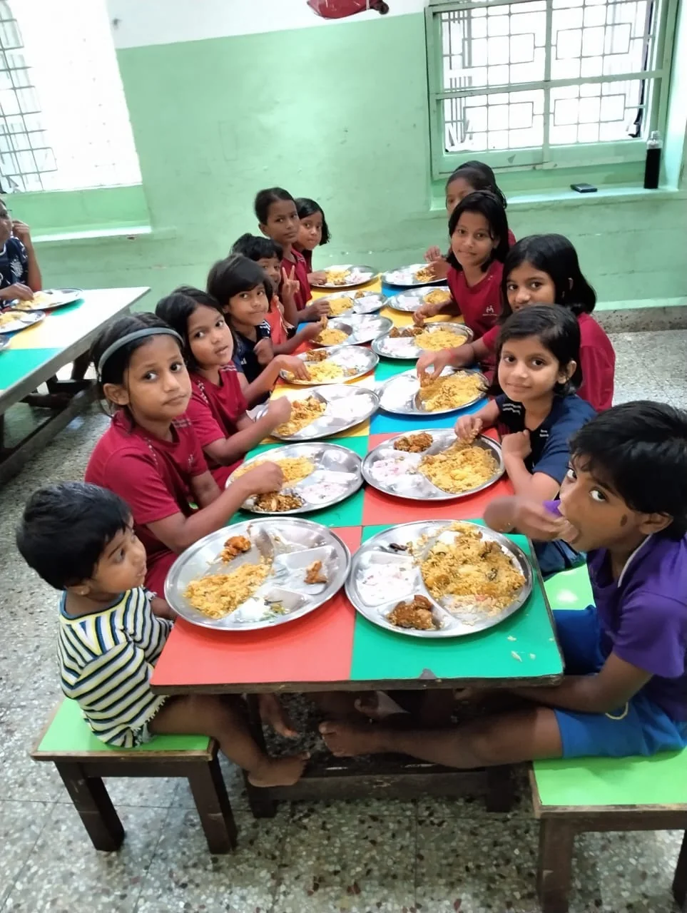 Children enjoying a freshly prepared meal together