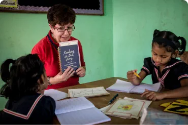 Volunteer working with children