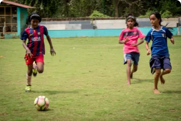 Girls playing football