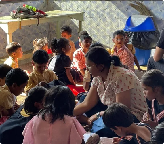 An El Shaddai volunteer spending time with children